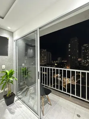 a balcony with a view of a city at night at Entrelagos beautiful apartment in Cartagena de Indias