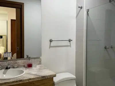 a bathroom with a shower and a toilet and a sink at New apartment with a beautiful view 2002 in Cartagena de Indias