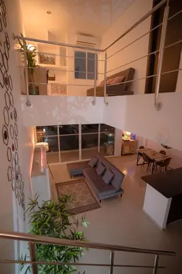 a living room with a couch and a table at Stunning Caribbean-Inspired PH next to Viva Mall in Barranquilla