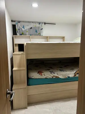 a bedroom with a wooden bunk bed in a room at Apartamento en Zona Estratégica de Barranquilla in Barranquilla