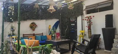 a living room with a couch and a table at Casa de Playa Salgar in Puerto Colombia