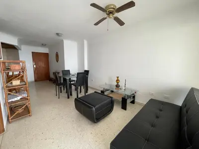 a living room with a couch and a ceiling fan at Altamar suite Cabrero in Cartagena de Indias