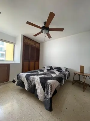 a bedroom with a bed with a ceiling fan at Altamar suite Cabrero in Cartagena de Indias