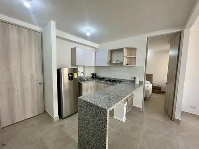 a kitchen with a counter top and a refrigerator at Apartamento Familiar cerca del la Playa in Cartagena de Indias