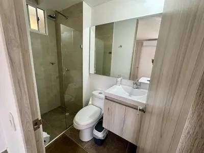 a bathroom with a toilet and a sink and a shower at Apartamento Familiar cerca del la Playa in Cartagena de Indias