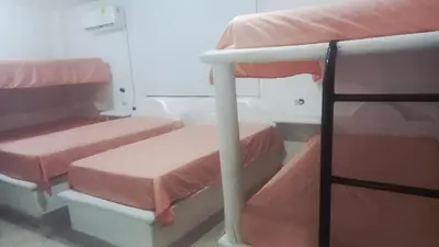 a group of bunk beds in a room at Cabaña Turística a Pasos del Mar, Ideal para Grupo in San Antero