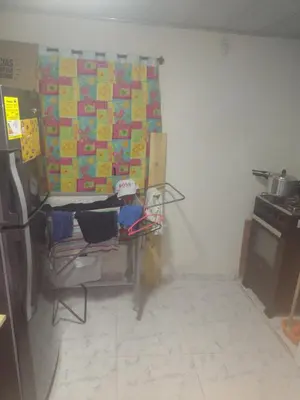 a kitchen with a table in the corner of a room at Aptoboston coloc in Cartagena de Indias