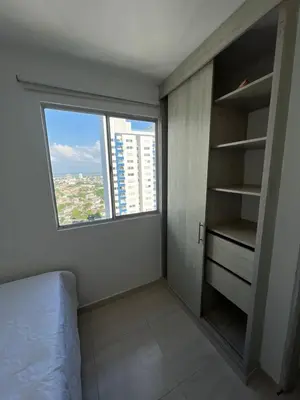 a bedroom with a window and a bed and a closet at Alina Beautiful Cartagena Apartment in Cartagena de Indias