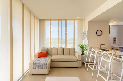 a living room with a couch and a table at Exclusive 2BR en Morros Eos with Pool & Parking in Cartagena de Indias
