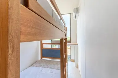 a small room with a bed and a window at Exclusive 2BR en Morros Eos with Pool & Parking in Cartagena de Indias