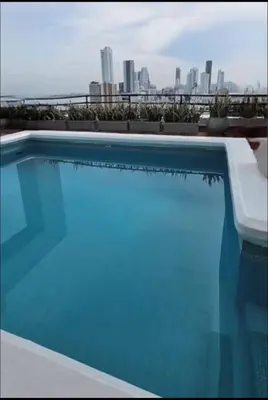 a swimming pool with a city skyline in the background at Modern Luxury 2BR with Private Jacuzzi in Cartagena de Indias