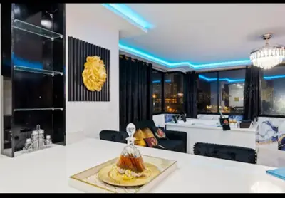 a living room with a table and a dining room at Modern Luxury 2BR with Private Jacuzzi in Cartagena de Indias