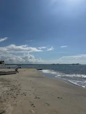a sandy beach with the ocean in the background at All new apartment in Santa Marta - NR Stays in Santa Marta
