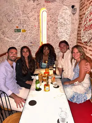 a group of people sitting around a table at Cartagena Rumbera in Cartagena de Indias