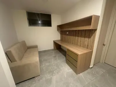 a room with a desk and a chair in it at Apartamento cerca Malecón y CC mall plaza in Barranquilla