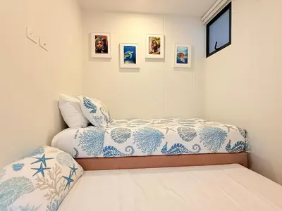a bedroom with a bed and pictures on the wall at Magnificent Apartment - Beach - Jacuzzis! in Cartagena de Indias