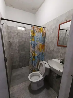 a bathroom with a toilet and a sink at Habitacion Ely Johana in Coveñas