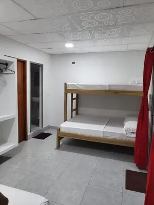 a bedroom with two bunk beds in a room at Habitacion Ely Johana in Coveñas