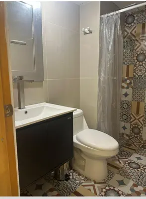 a bathroom with a toilet and a sink and a shower at Comfortable and nice apartment in Barranquilla