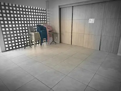 a group of chairs sitting in a room at Modern apt in Cartagena with pool and beach access in Cartagena de Indias