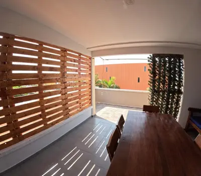 a dining room with a table and a large window at Cartagena loft apartment near historic center in Cartagena de Indias