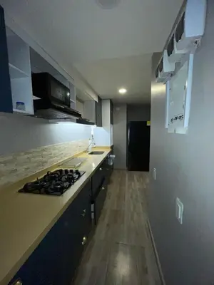 a kitchen with a stove and a counter top at Exclusivo apartamento en ciudad Mallorquin in Barranquilla
