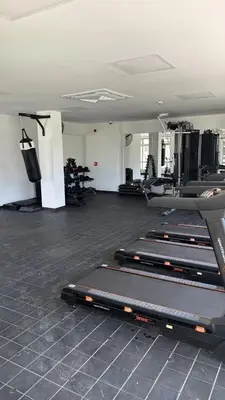 a gym with rows of tread machines in a room at Exclusivo apartamento en ciudad Mallorquin in Barranquilla