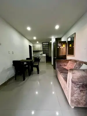 a living room with a couch and a table at Apartamento DUPLEX para Grupos 9 pax in Cartagena de Indias
