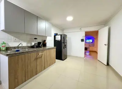 a kitchen with a sink and a refrigerator at Apartamento en Cartagena Manga 3 Habitaciones - Bahia in Cartagena de Indias