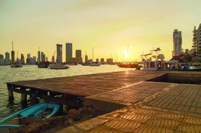 a dock with boats in the water near a city at Apartamento en Cartagena Manga 3 Habitaciones - Bahia in Cartagena de Indias