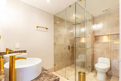 a bathroom with a shower and a sink and a toilet at Luxury House in the heart of Cartagena with Jacuzzi in Cartagena de Indias