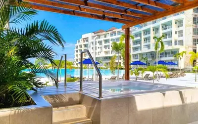 a hot tub on a patio in front of a building at Apartamentos Baia Kristal - Escapada a Cartagena in Cartagena de Indias