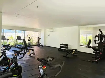 a gym with bikes and exercise equipment in a room at Apartamentos Baia Kristal - Escapada a Cartagena in Cartagena de Indias