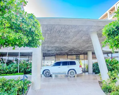 a white van parked in a parking lot at Apt 2 rooms with private beach and ideal pool in Cartagena de Indias
