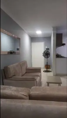 a living room with a couch and a table at Piezas en arriendo Barranquilla in Barranquilla