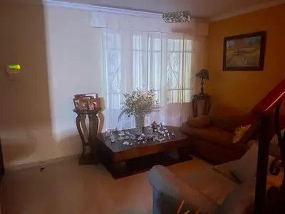 a living room with a couch and a table at hermosa habitacion in Barranquilla