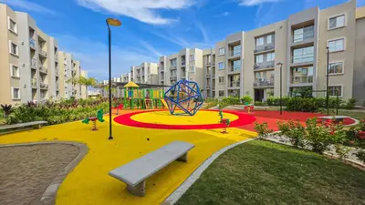 a playground with a bench in the middle of a park at Capriella, Serena Del Mar in Cartagena de Indias
