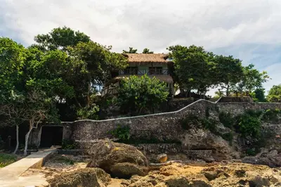 a house on top of a stone wall at Paradise Private Kaimari Ocean Villa in Cartagena de Indias