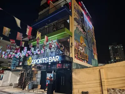 a sports bar with a sign on the side of a building at King's Apartments 402 in Cartagena de Indias