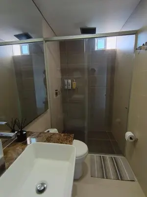 a bathroom with a shower and a white toilet at 612 Beautiful Apartment Near the Walled City in Cartagena de Indias