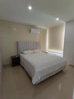 a bedroom with a large bed in a room at 612 Beautiful Apartment Near the Walled City in Cartagena de Indias