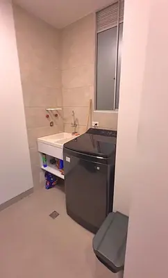 a small bathroom with a sink and a mirror at Aqua Marine Suite - Santa Marina Condo in Santa Marta
