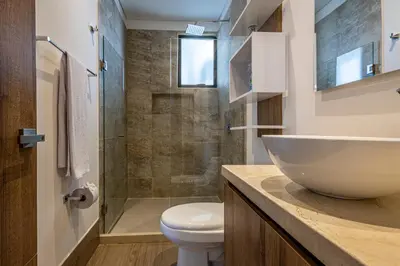 a bathroom with a sink and a toilet at NEW Apartment, best rooftop pool view, Cartagena - Visitors NOT ALLOWED in Cartagena de Indias
