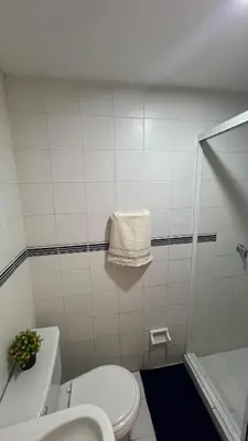 a bathroom with a white toilet and a shower at Apartamento Marina del Rey 1101 in Cartagena de Indias