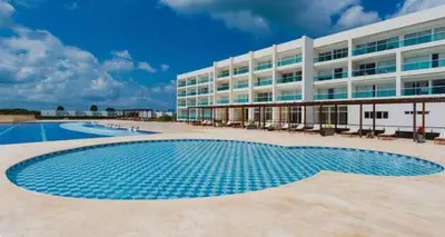 a swimming pool in front of a building at Apto puerto velero in Barranquilla