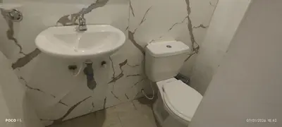 a bathroom with a sink and a toilet at Hotel WK Casa de Hospedaje in Barranquilla