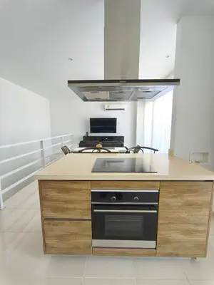 a kitchen with a stove and a counter top at Apto 411 puerto velero in Tubará
