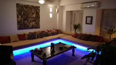 a living room with a couch and a table at Casa Del Hobo in Cartagena de Indias
