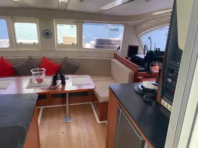 a small boat with a desk and a table at Catamaran in Cartagena Bay in Cartagena de Indias