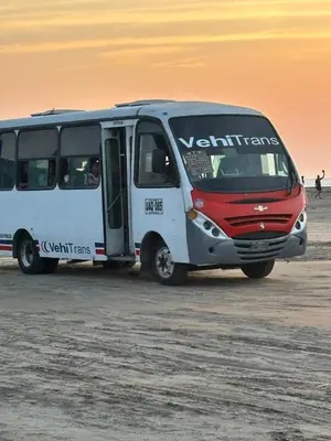 a white and red bus parked in the desert at Hostel cartagena in Cartagena de Indias